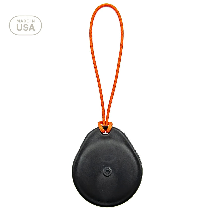 Black round object with an orange strap on a white background