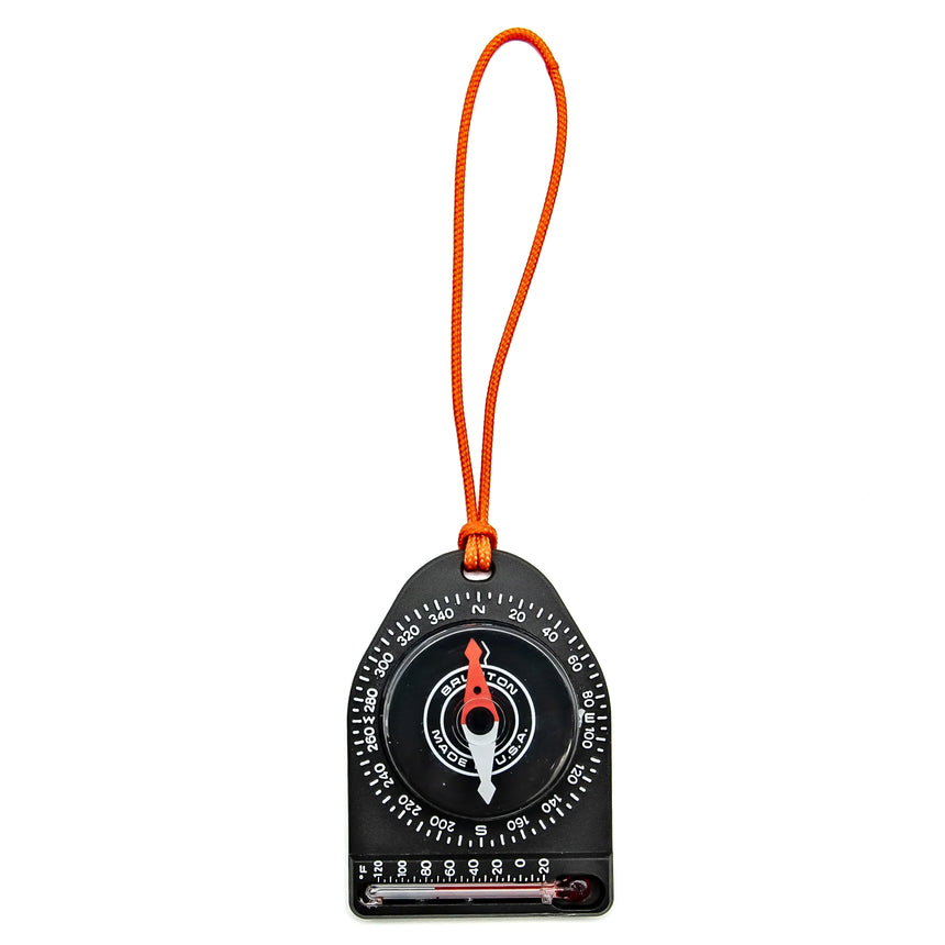 Compass with orange strap on a white background