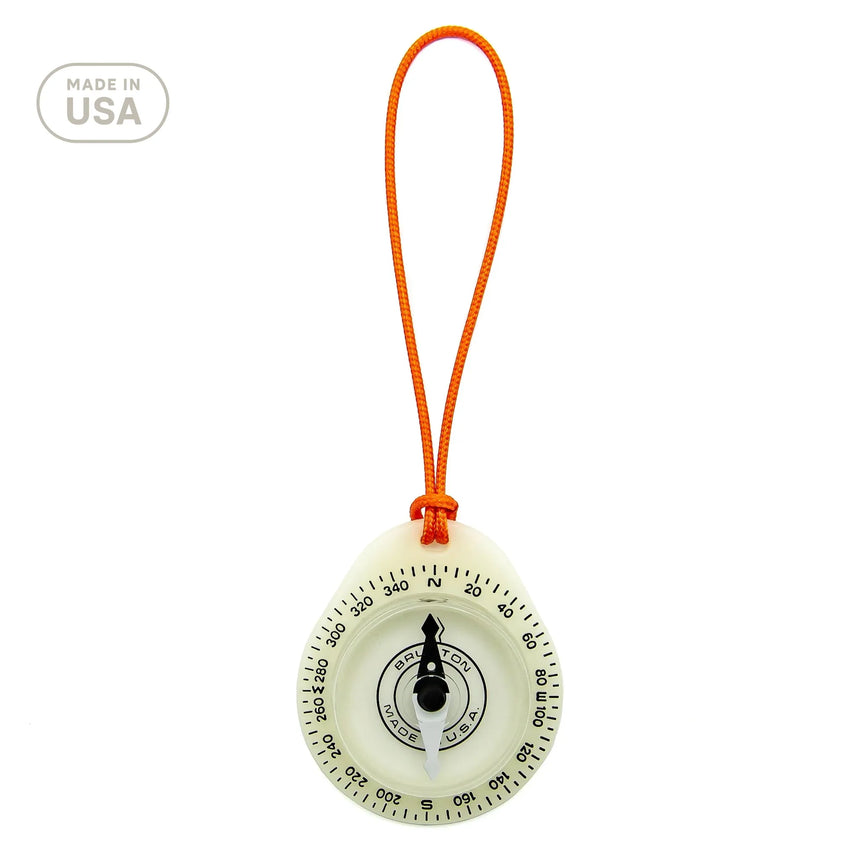 Compass with orange string on a white background