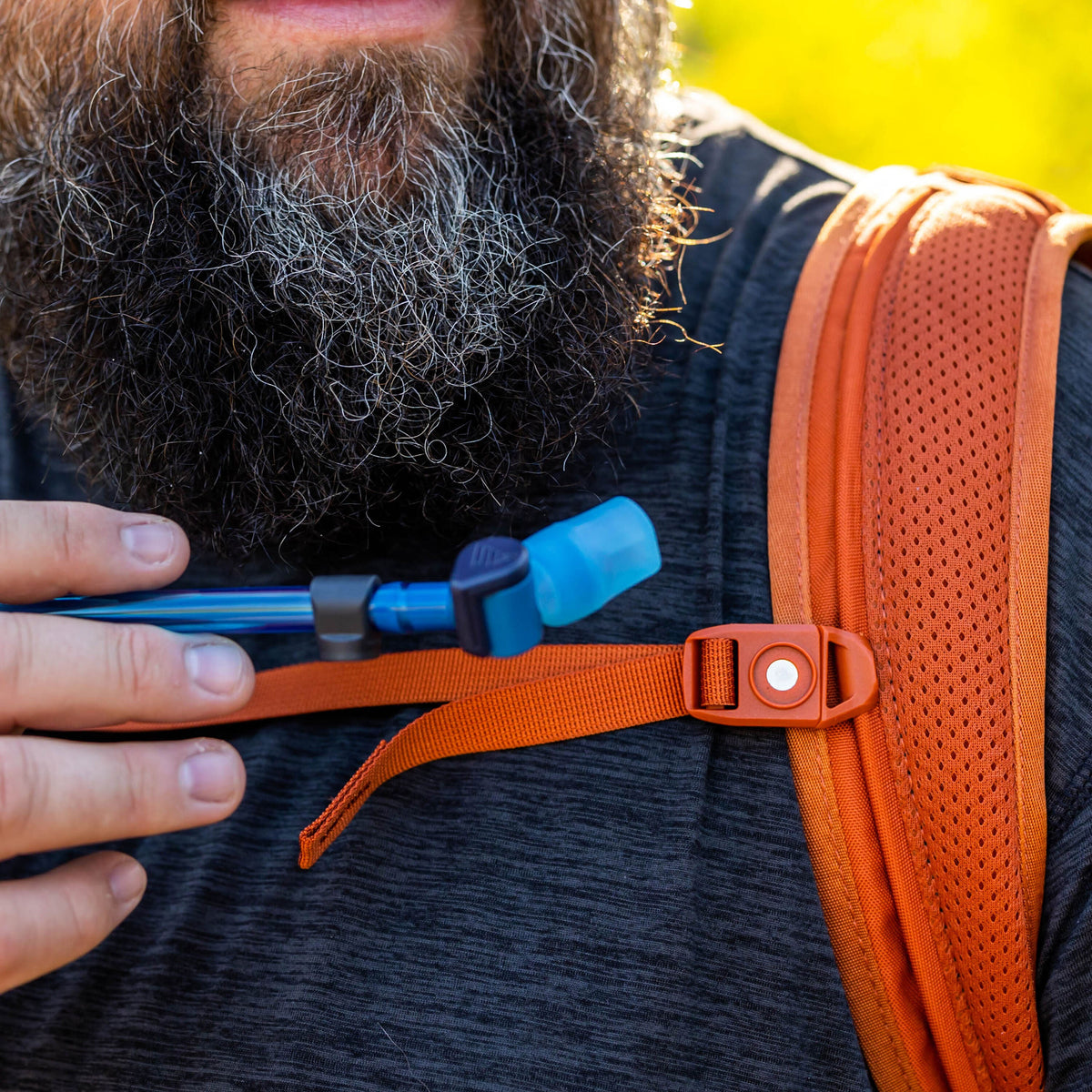 Gregory 3D Hydro 2L Reservoir in Ocean/Orange - magnetic clip bite valve detail, worn