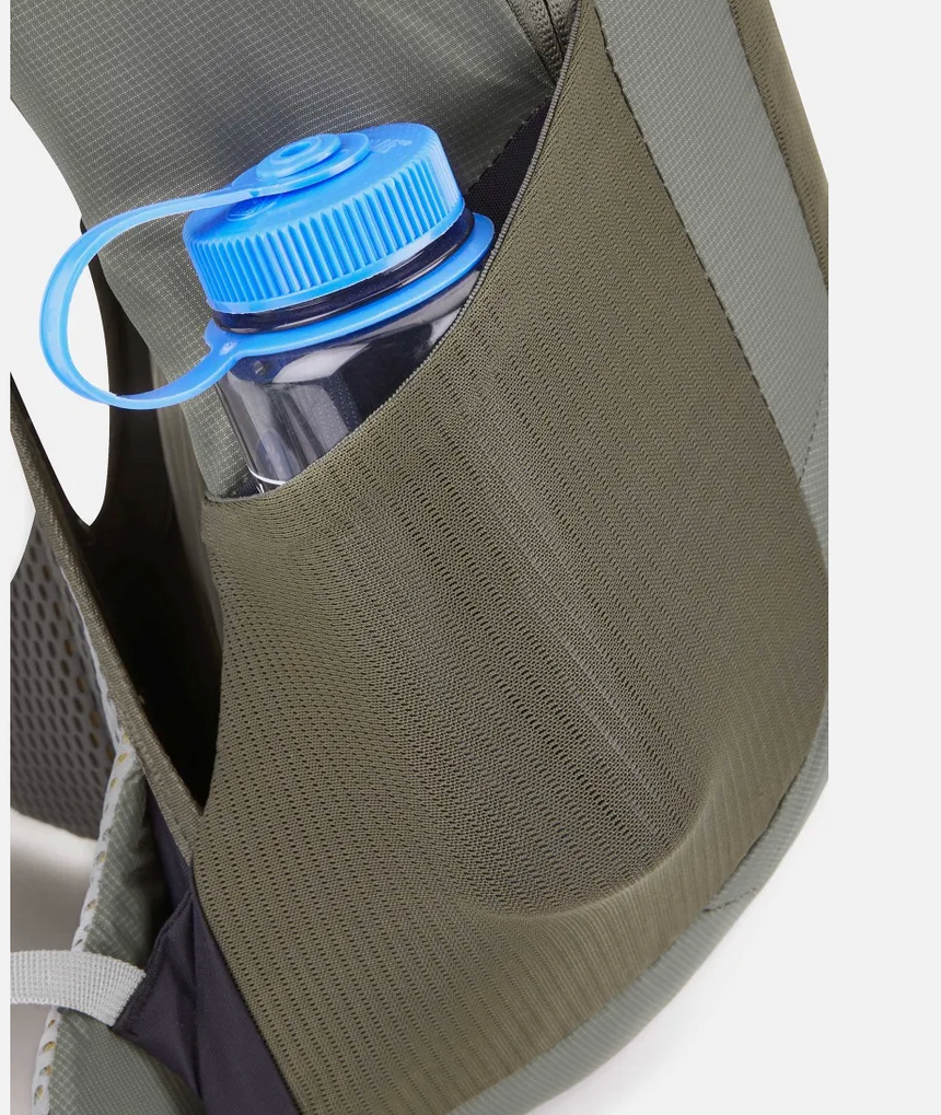Water bottle with blue cap in a backpack pocket