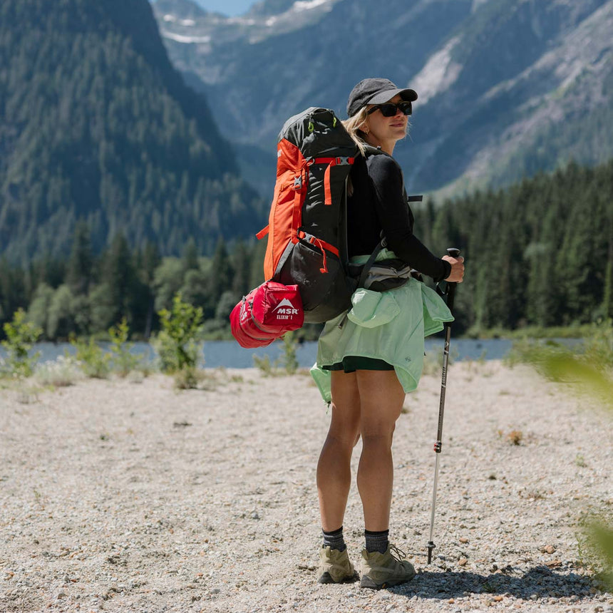 MSR Elixir™ 1-Person Backpacking Tent Outdoor Action-Stuff sack secured with straps on bag