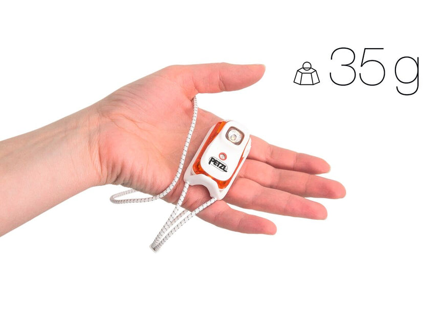 Petzl Bindi® Rechargeable Headlamp Orange - Model Holding Product