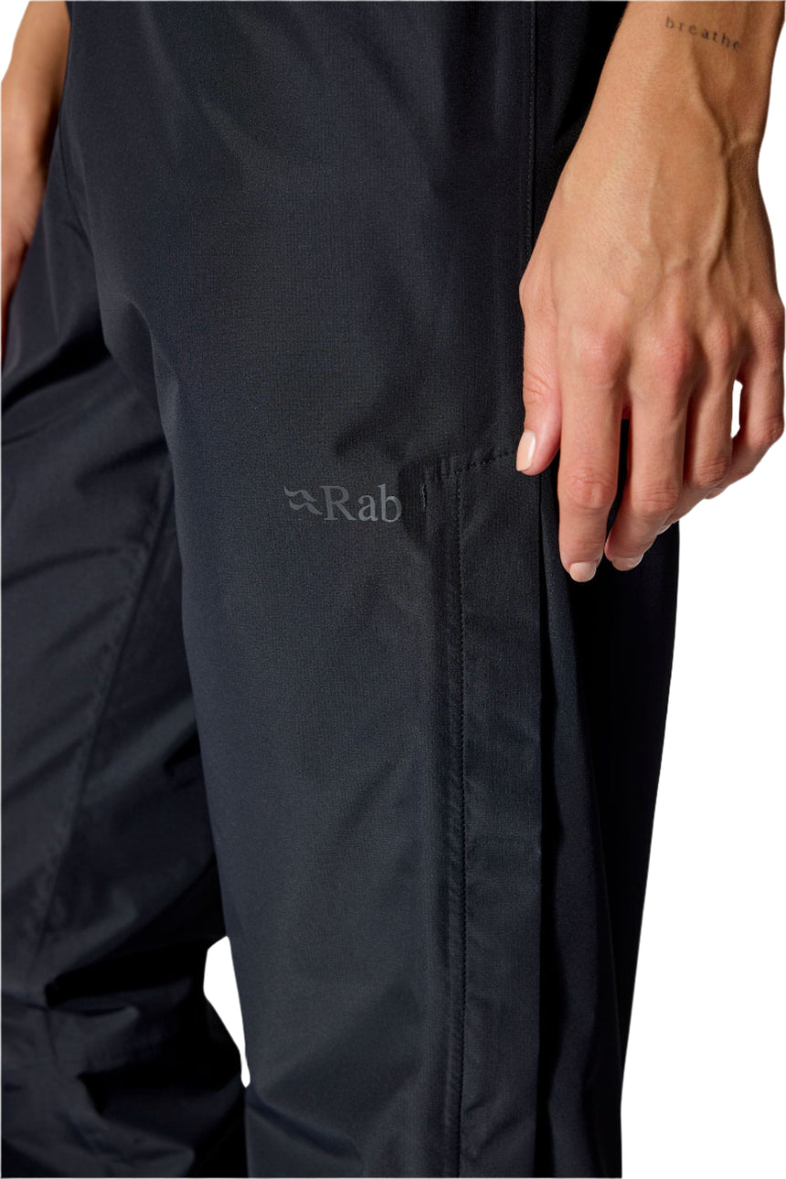 Rab Women's Downpour Waterproof Pants in Black - side zip detail, lower leg, worn