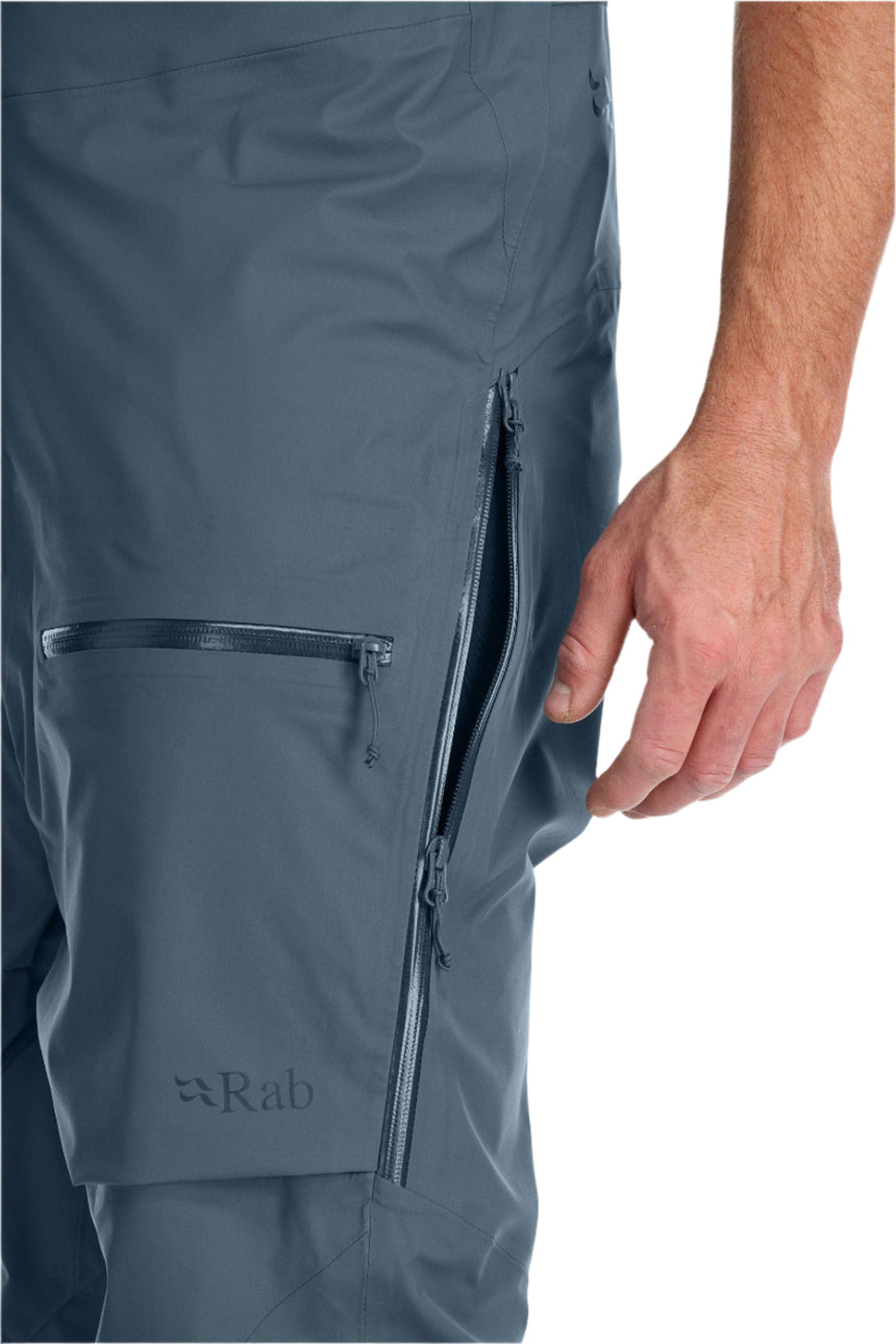 Rab Men's Khroma Kinetic Waterproof Bib Pants in Orion Blue - thigh pocket detail