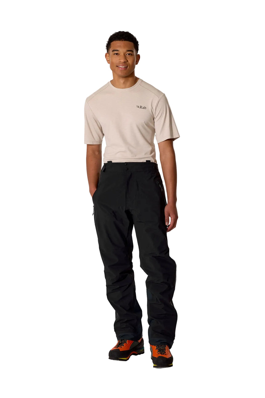 Rab Men's Firewall Guide Waterproof Pants in Black - worn front on model