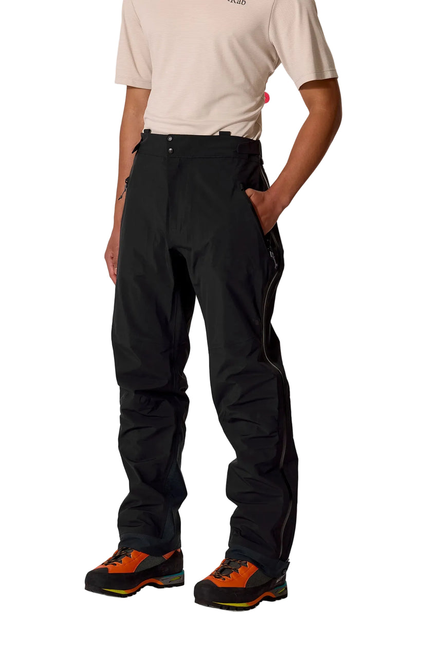 Rab Men's Firewall Guide Waterproof Pants in Black - worn front on model