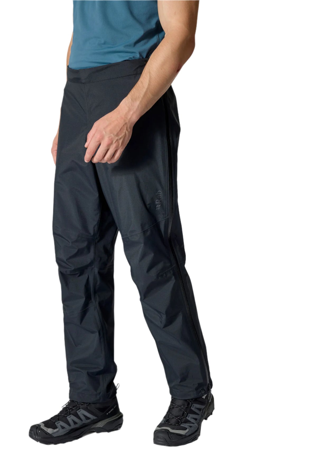Rab Men's Firewall Mountain Waterproof Pants in Black - hem detail, worn