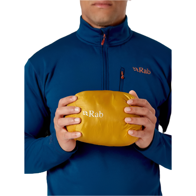 Rab Men's Microlight Down Vest in Navy (styling reference) - worn, stuff sack detail