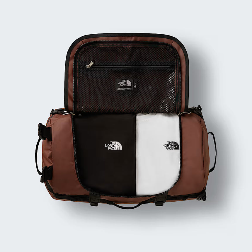 The North Face Base Camp Duffel Small 50L Ember Soil/TNF Black - top view showing D-zip opening and compression straps