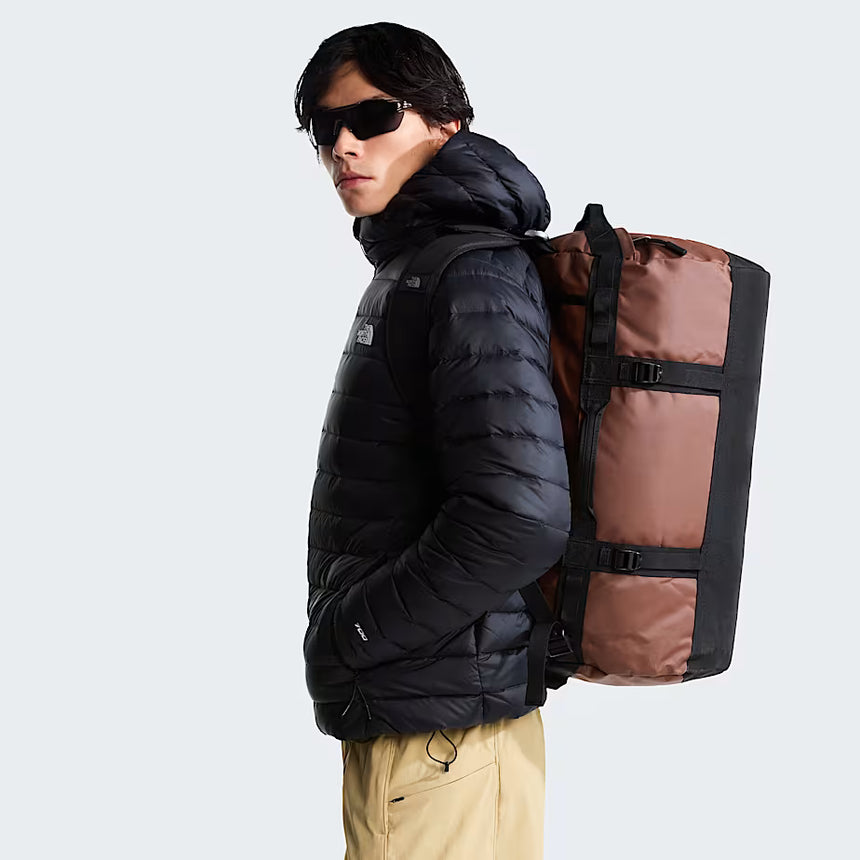 The North Face Base Camp Duffel Small Ember Soil/TNF Black - side view with detachable ergonomic shoulder straps and padded handles