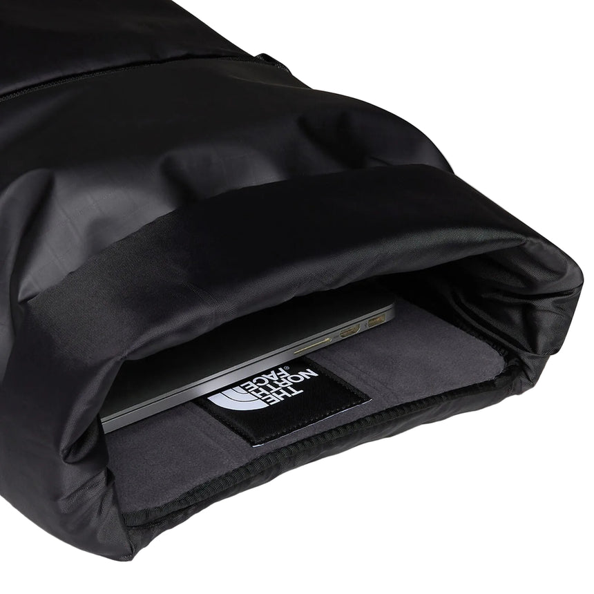 The North Face Base Camp Voyager Roll Top Backpack 25L being worn, demonstrating comfortable all-day carry