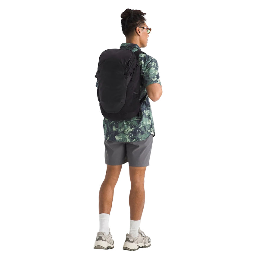 Side view of The North Face Kaban LTE Backpack displaying water bottle pockets and compression straps