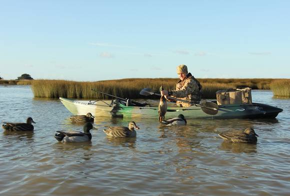 Mission CATCH 390 kayak, Camo kayak in use on calm water