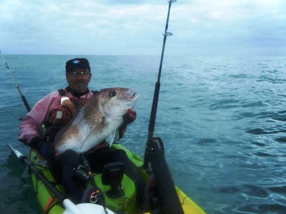 Mission CATCH 420 EXP kayak, angler fishing from the kayak