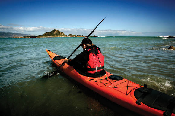 Mission ECO BEZHIG 540 kayak, Red Fade cockpit and deck on the water