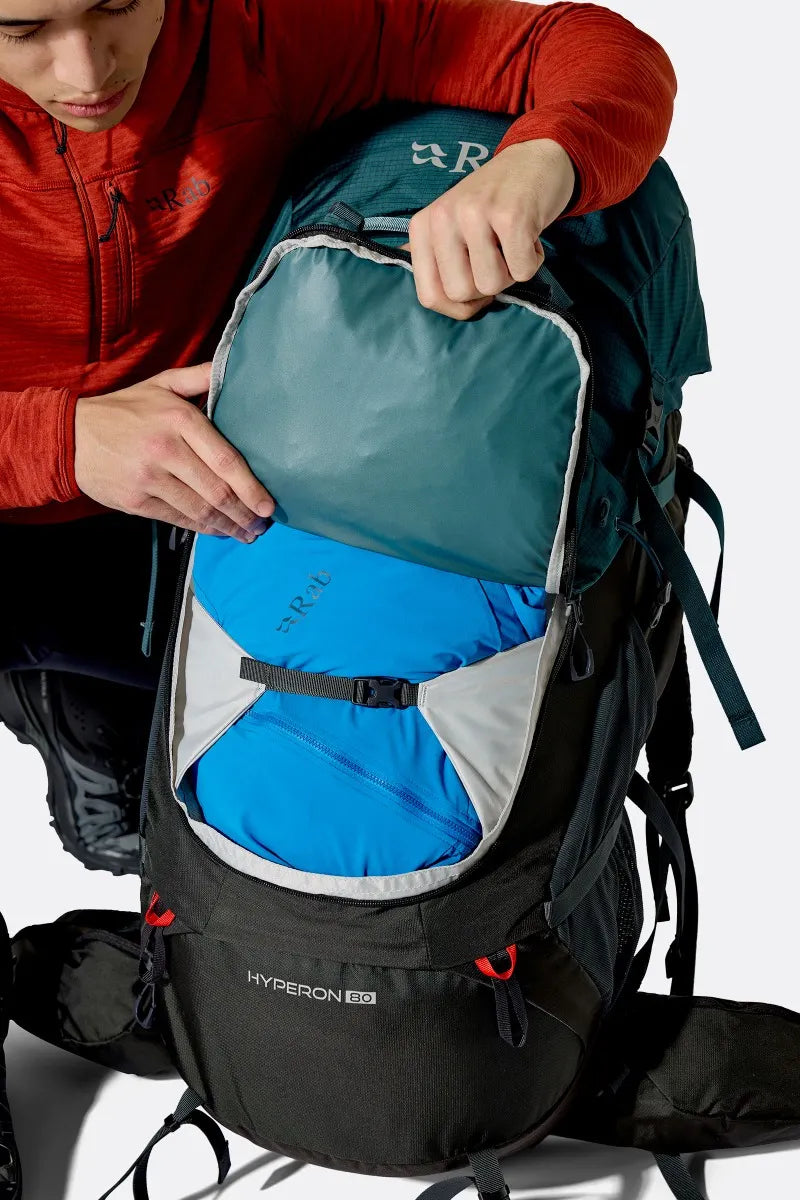 Rab Hyperon 80L Trekking Pack in Orion Blue/Anthracite - front pocket, worn