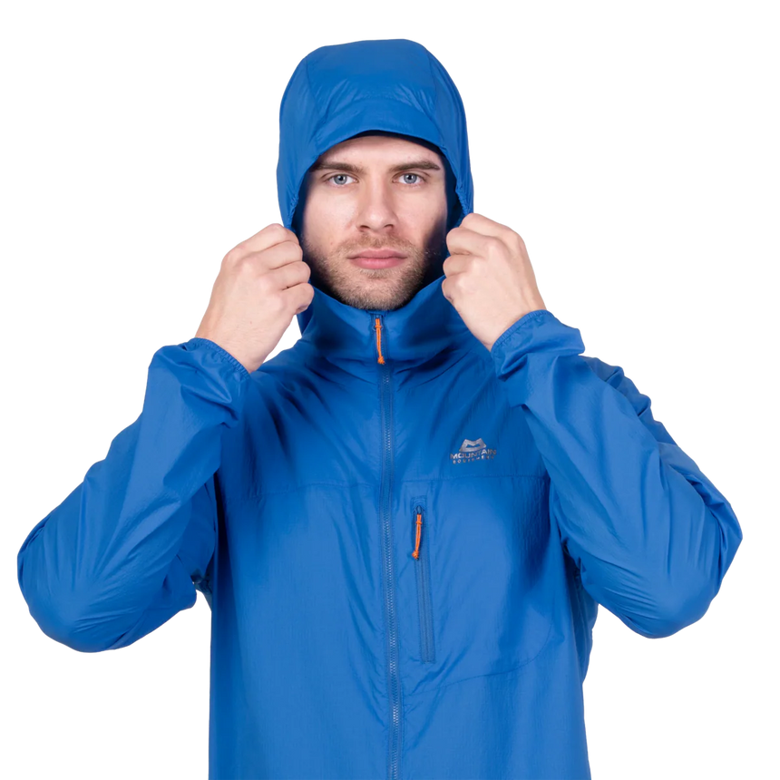 Zipped chest pocket detail on Mountain Equipment Aerofoil Hooded Men's Jacket in Atlantic Blue doubling as stuff sack with twin karabiner carry loops