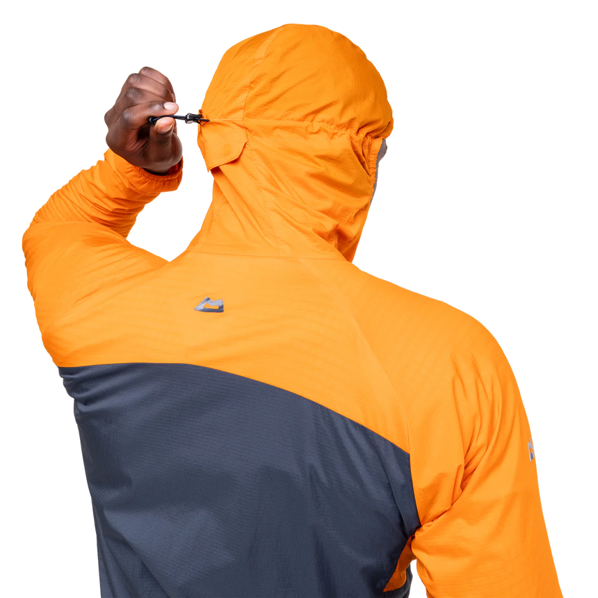 Zipped chest pocket detail on Mountain Equipment Aerotherm Men's Jacket in Blue Nights/Ember doubling as stuff sack with twin karabiner carry loops