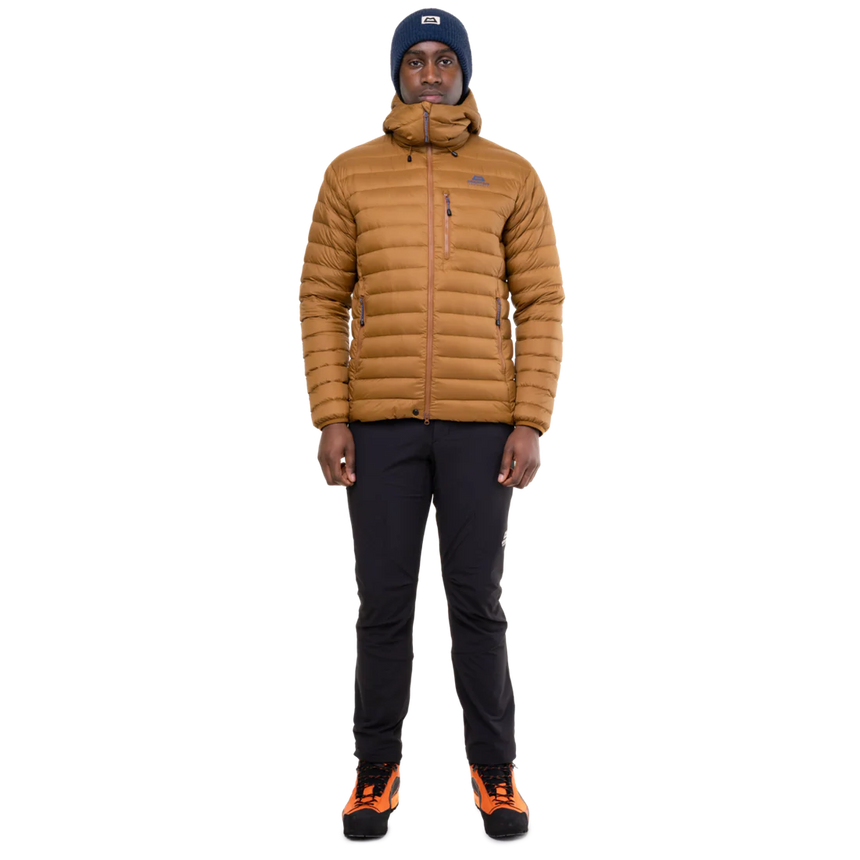 Mountain Equipment Earthrise Hooded Men's Jacket in Walnut - lifestyle view showing lightweight recycled down insulation for ski touring and alpine climbing