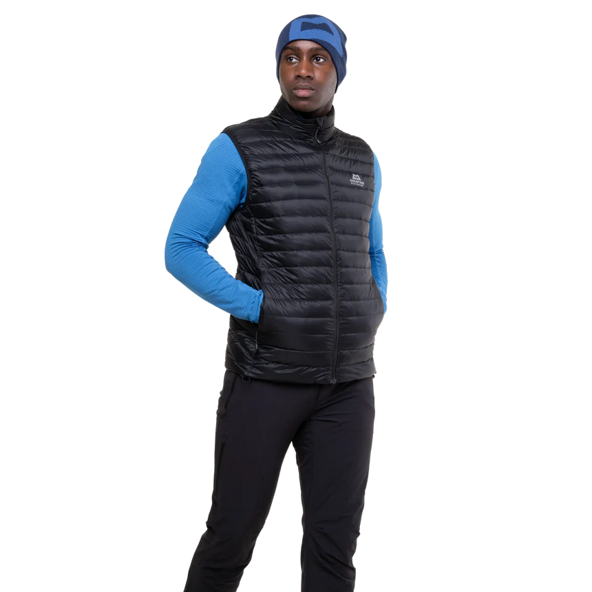 Mountain Equipment Frostline Men's Vest in Black worn on model - angled front view showing DRILITE Loft 20D shell and stitch-through narrow baffles