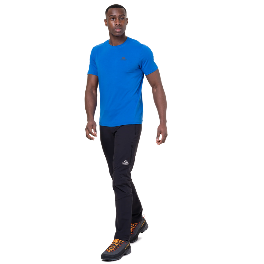 Mountain Equipment Groundup Men's Tee in Atlantic Blue - lifestyle view showing lightweight technical tee for rock climbing on hot days