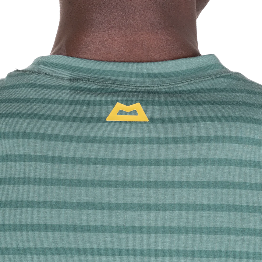 Mountain Equipment Groundup Men's Tee in Fern Stripe - lifestyle view showing fast-drying stretchy tee for mountain walking and trekking