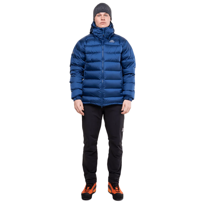 Mountain Equipment Lightline Men's Jacket in Admiral Blue - lifestyle view showing technical duvet jacket for mountaineering in sub-zero conditions