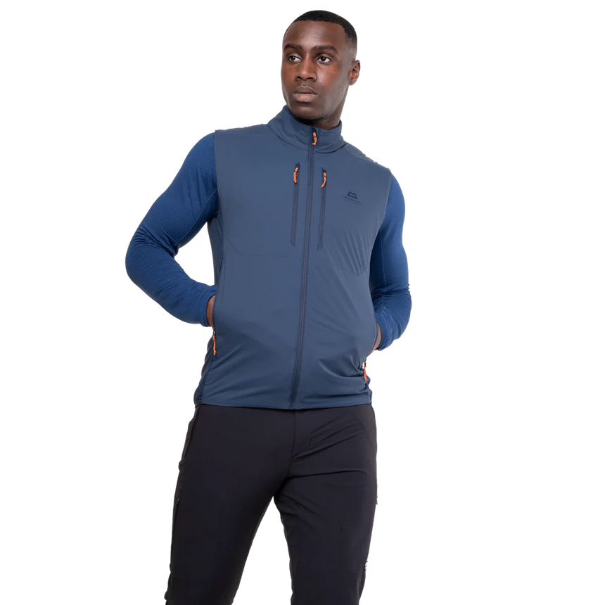 Mountain Equipment Switch Men's Vest in Dusk/Cosmos - detail view showing zipped hand pocket positioned for use with a harness or rucksack waistbelt