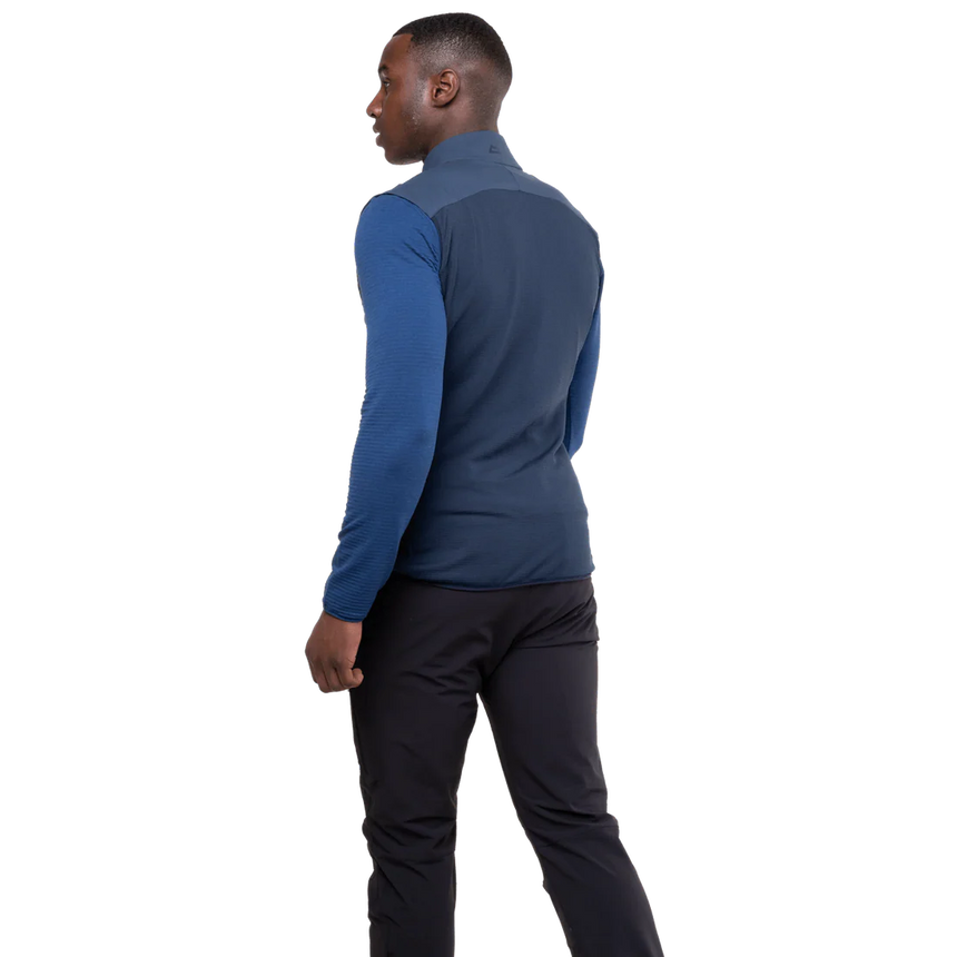 Mountain Equipment Switch Men's Vest in Dusk/Cosmos - lifestyle view showing hybrid insulated vest for alpine climbing and ski touring