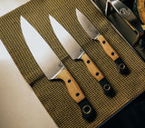Benchmade 4000-02 three-piece kitchen knife set in Maple Valley Richlite, stored in knife roll