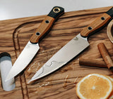 Benchmade 4000-02 three-piece kitchen knife set in Maple Valley Richlite, on chopping board