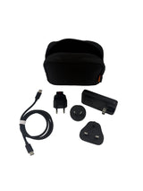 Collection of travel accessories including a black carrying case, plugs, and cables