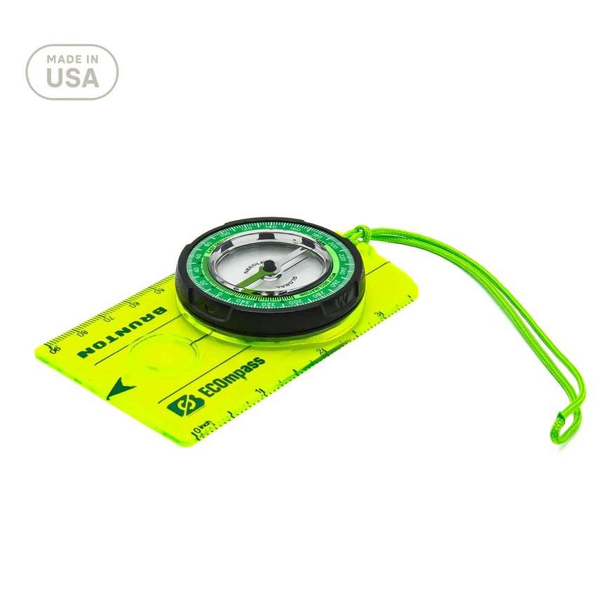 Compass with a green case and strap on a white background