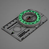 Compass with green glow on a white background