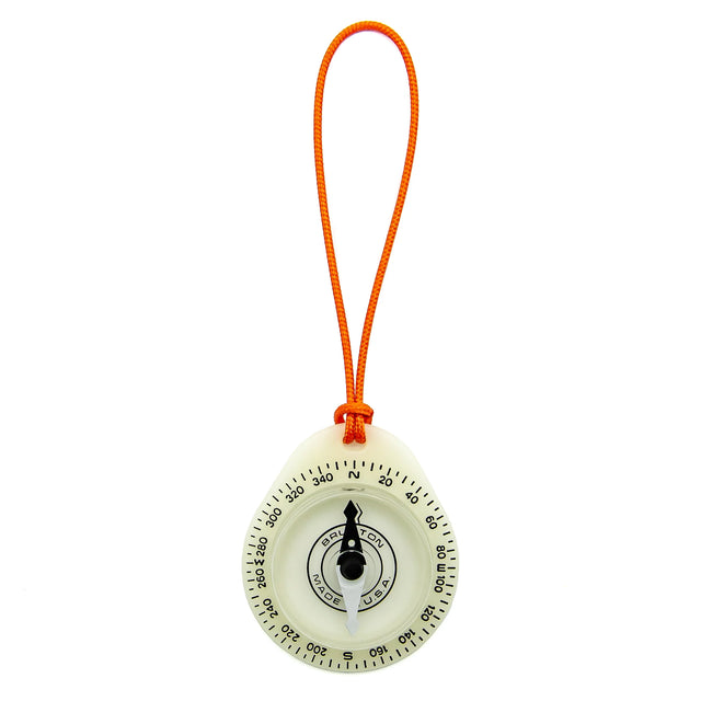 Compass with orange string on a white background