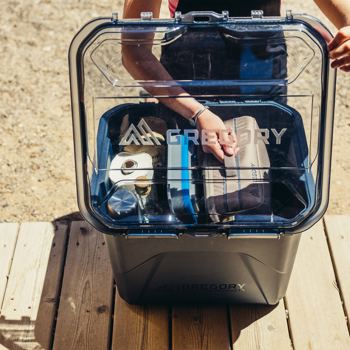 Gregory Alpaca Camp Box 50L in Slate Blue - Being carried outdoors
