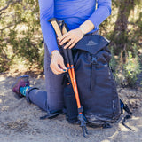 Gregory Kiro 28L Daypack in Alpine Black - trekking pole attachment detail, worn