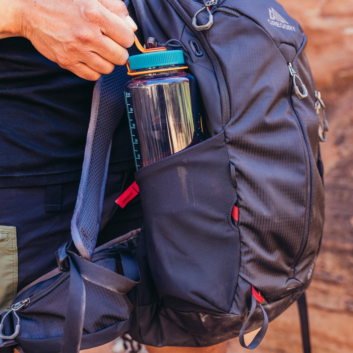 Gregory Zulu LT 24 Men's Hiking Backpack - mesh bottle holder detail, worn