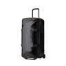 Gregory Alpaca Wheeled Duffel 100L in Obsidian Black - Front View with telescoping handle and oversized wheels