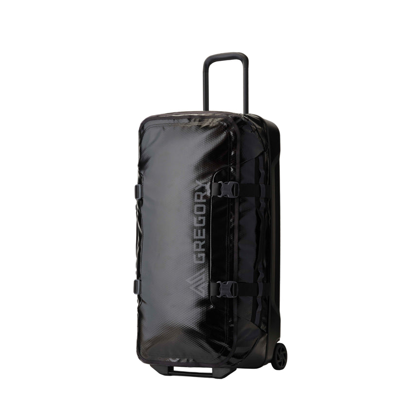 Gregory Alpaca Wheeled Duffel 100L in Obsidian Black - Front View with telescoping handle and oversized wheels
