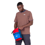 Mountain Equipment Lava Men's Tee in Stanage Stripe - Three quarter view with bag