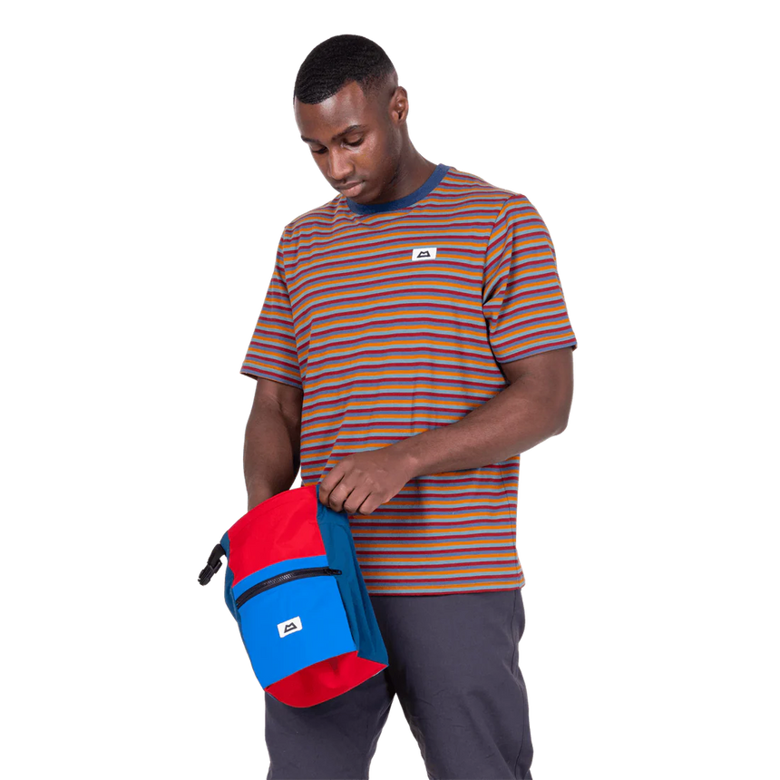 Mountain Equipment Lava Men's Tee in Stanage Stripe - Three quarter view with bag