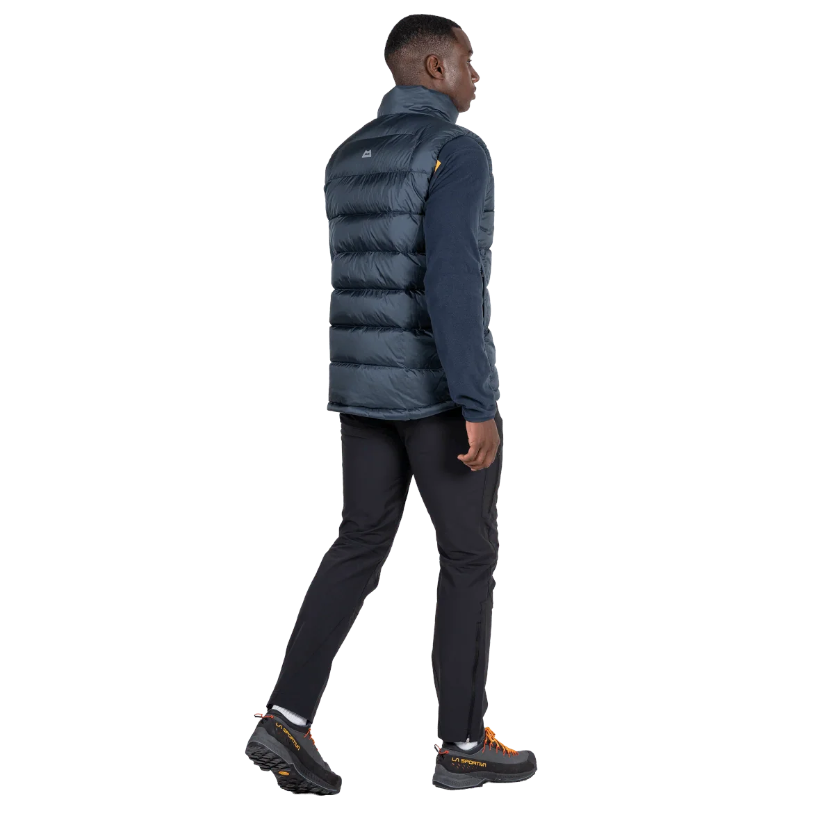 Mountain Equipment Lightline Men's Vest in Blue Nights - back view on model showing stitch-through baffle construction and dual tether hem drawcords