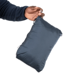 Mountain Equipment Lightline Men's Vest in Blue Nights packed into internal pocket showing lightweight packable construction