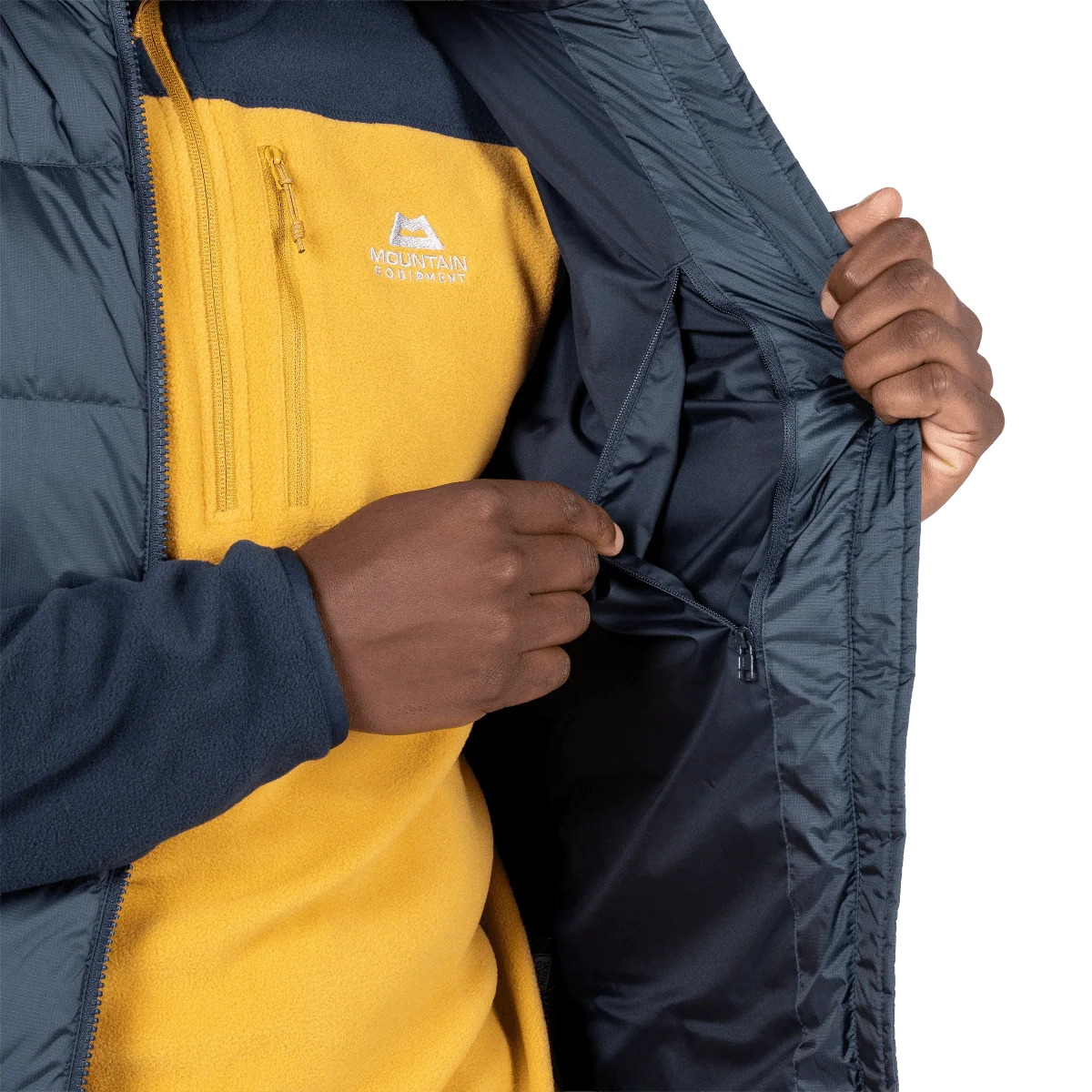 Mountain Equipment Lightline Men's Vest in Blue Nights - detail view showing zipped hand warmer pocket and Drilite Loft windproof outer fabric