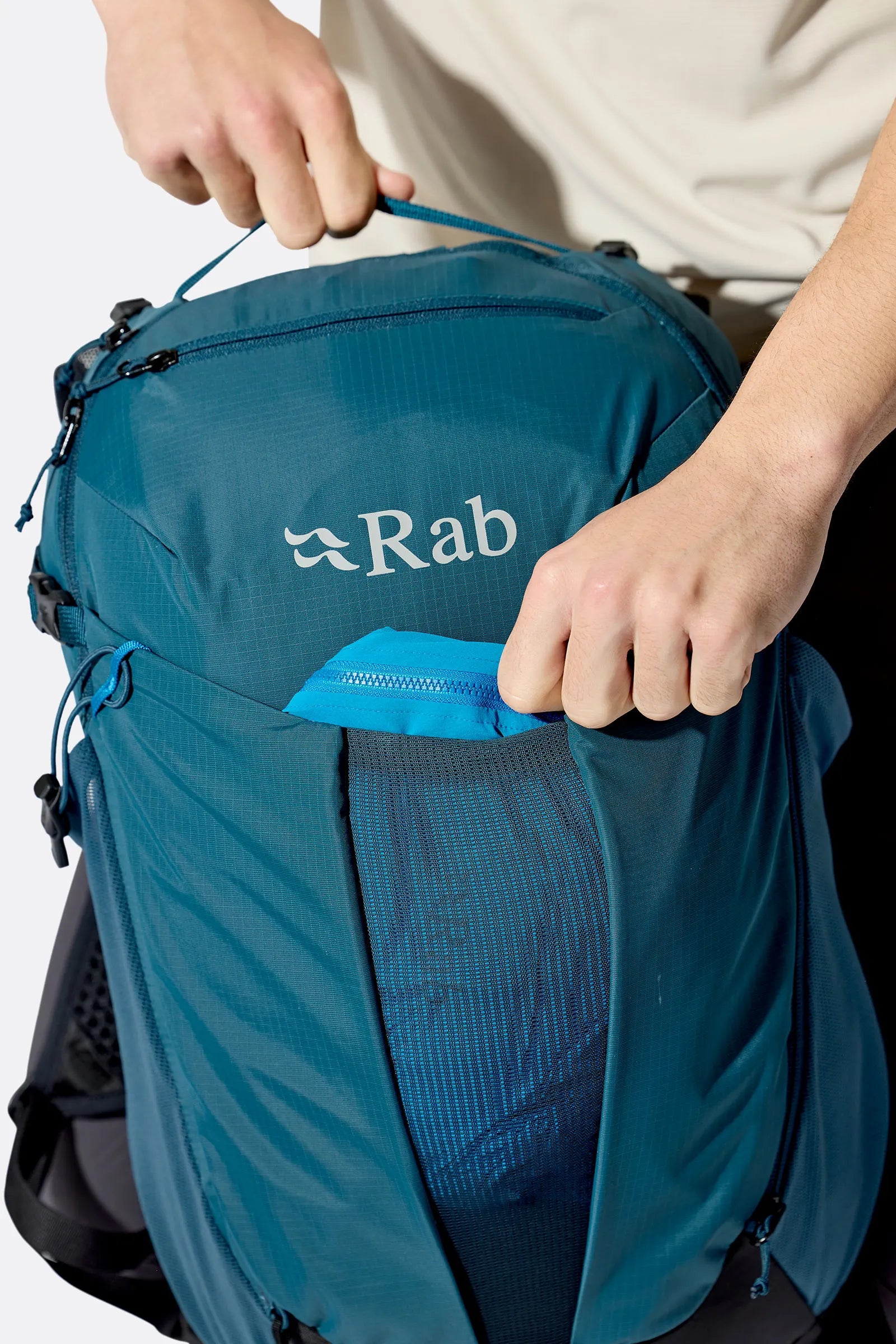 Rab Airox 24L Day Pack in Tempest Blue - On Model Back View with Poles
