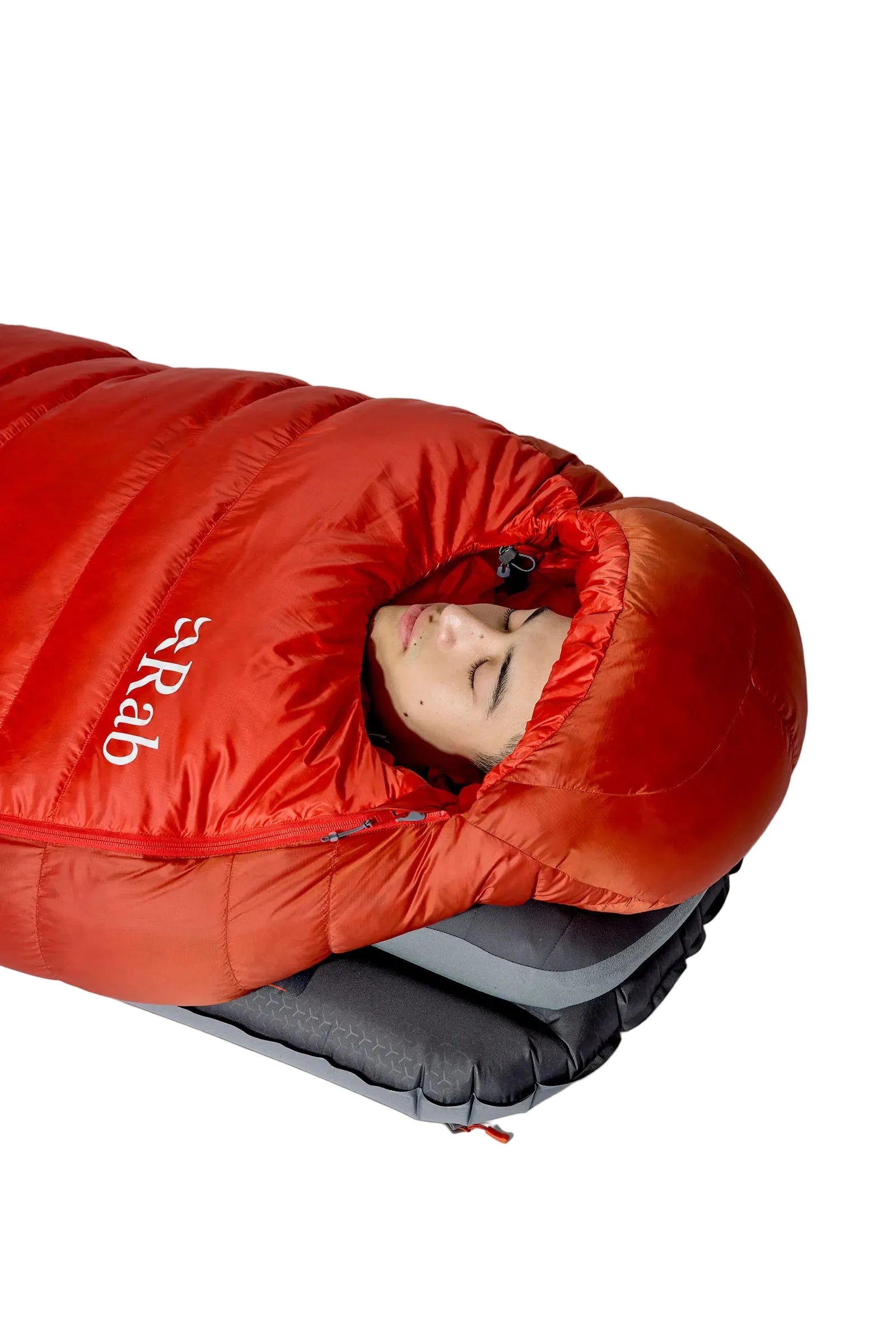 Rab Alpine Down Sleeping Bag (-18°C/0F) in Dark Horizon/Tuscan Red - Model Close-Up, Face Peeking from Hood