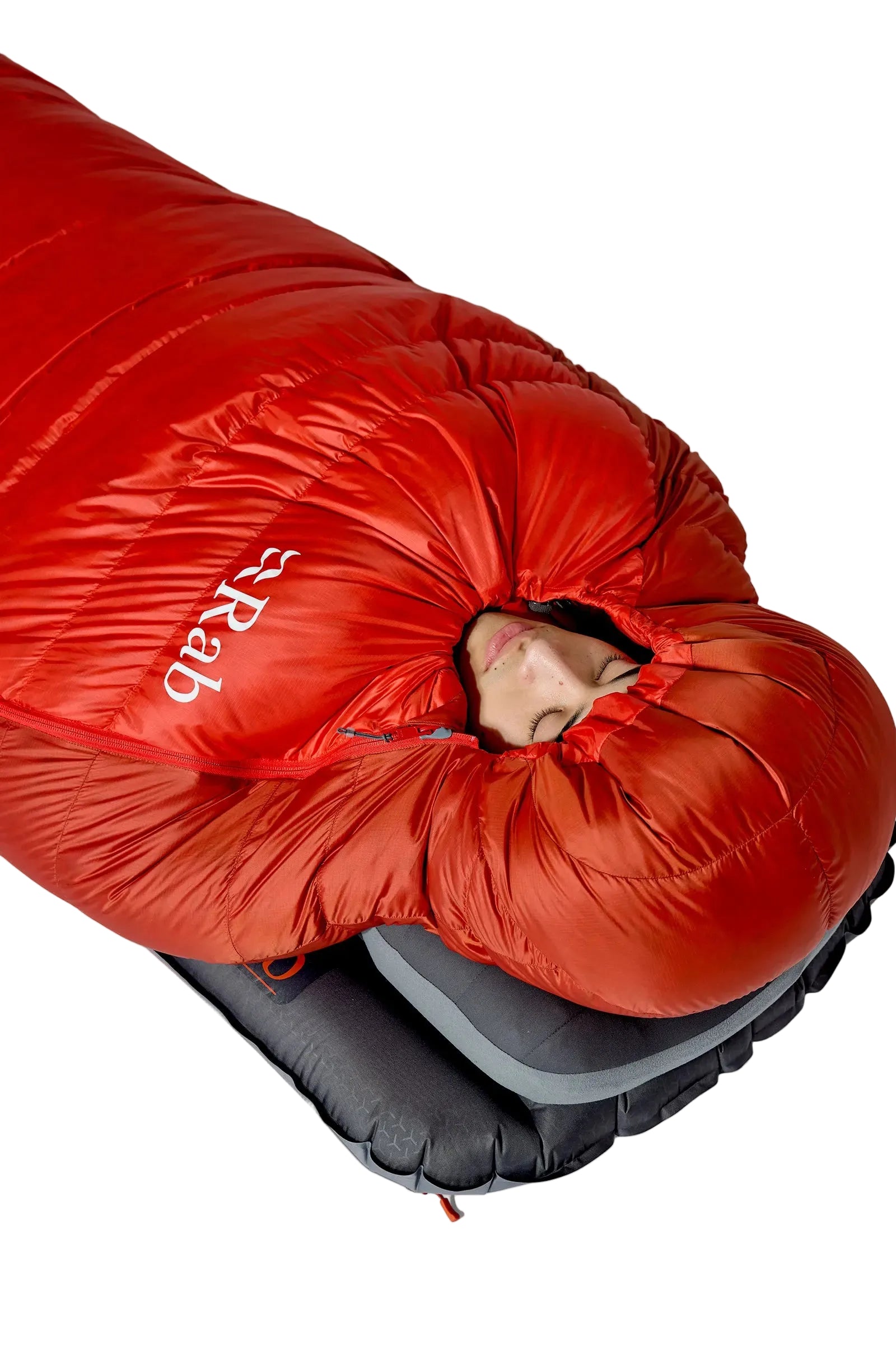 Rab Alpine Down Sleeping Bag (-18°C/0F) in Dark Horizon/Tuscan Red - Model Lying Wrapped on Mat, Alternate Angle