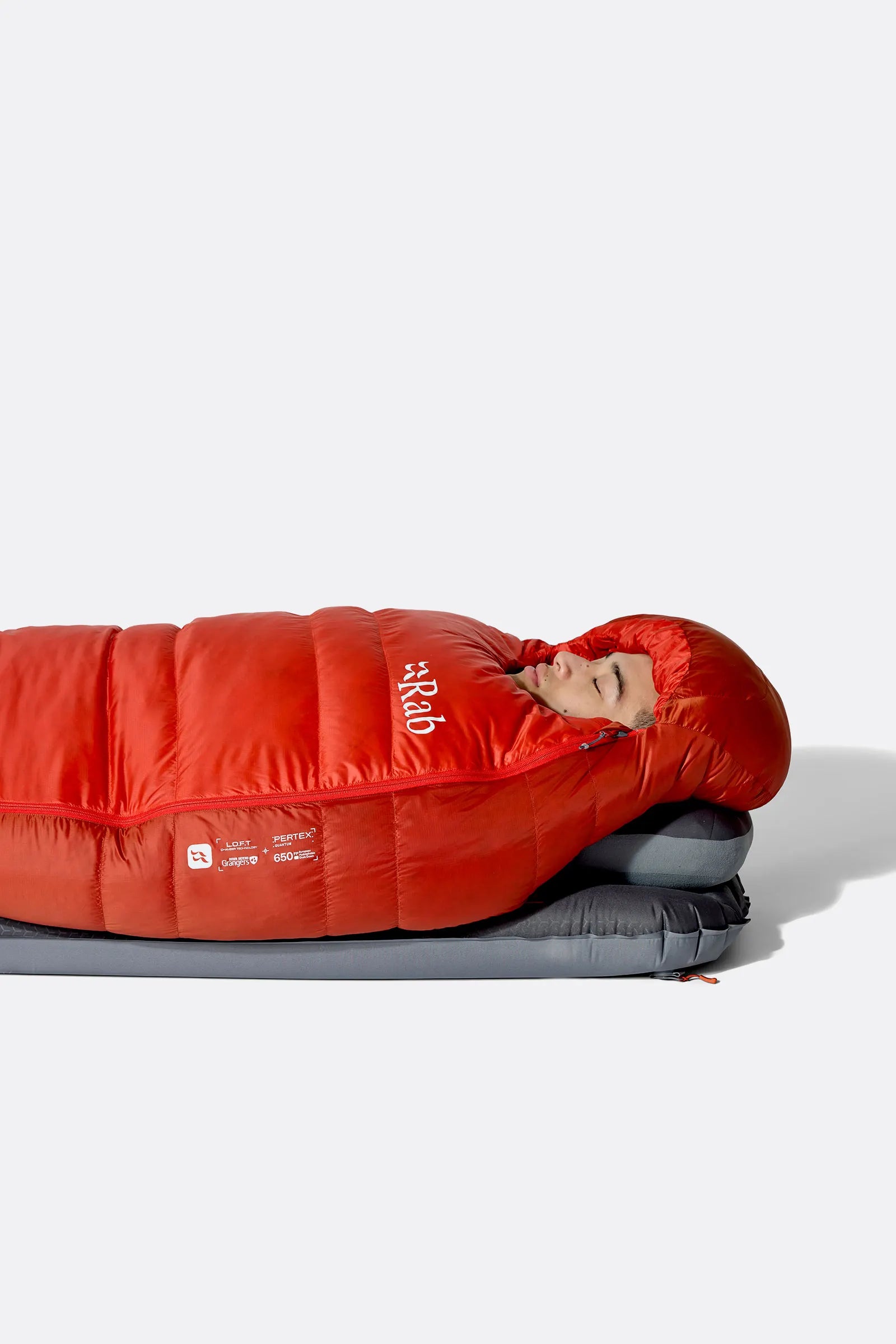 Rab Alpine Down Sleeping Bag (-18°C/0F) in Dark Horizon/Tuscan Red - Zip Pull, Hand Detail